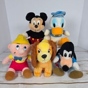 Vintage lot of Walt Disney Plush Characters: 1 Mickey Mouse, 1 Donald Duck, 1 Go